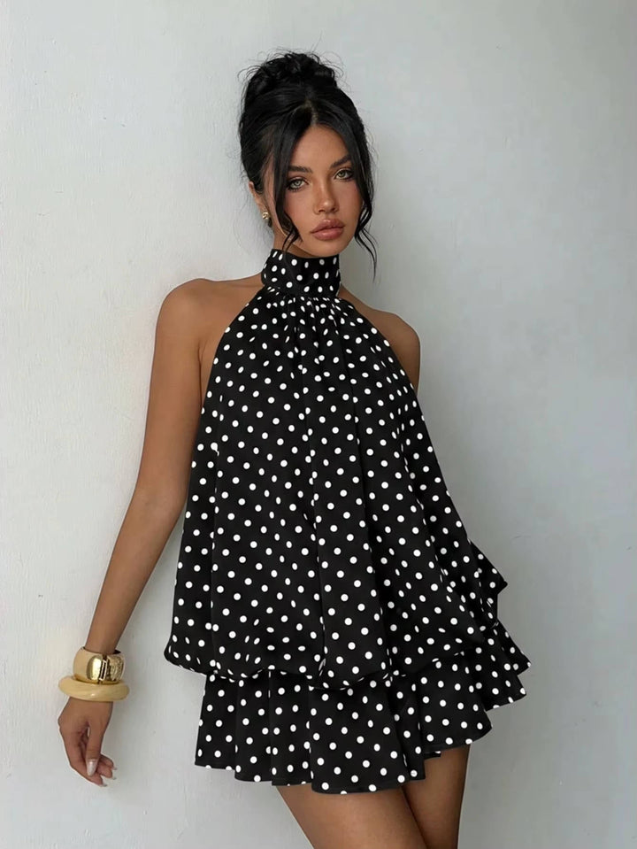 Women's flirty open back mini dress, halter neckline, with a playful ruffle hem for a chic look.