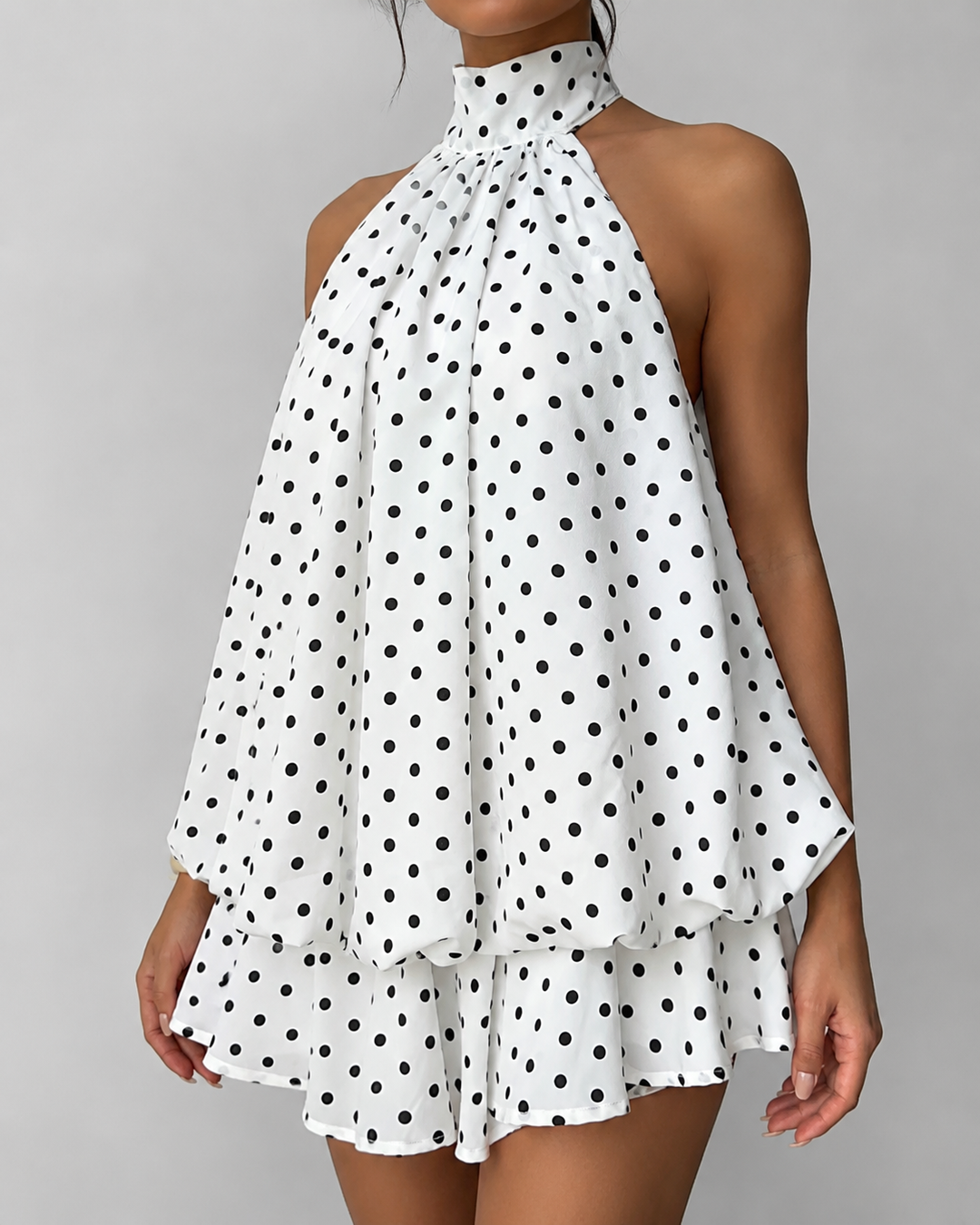 Summer casual halter mini dress for women, with a cute ruffle hem and comfortable open back style.