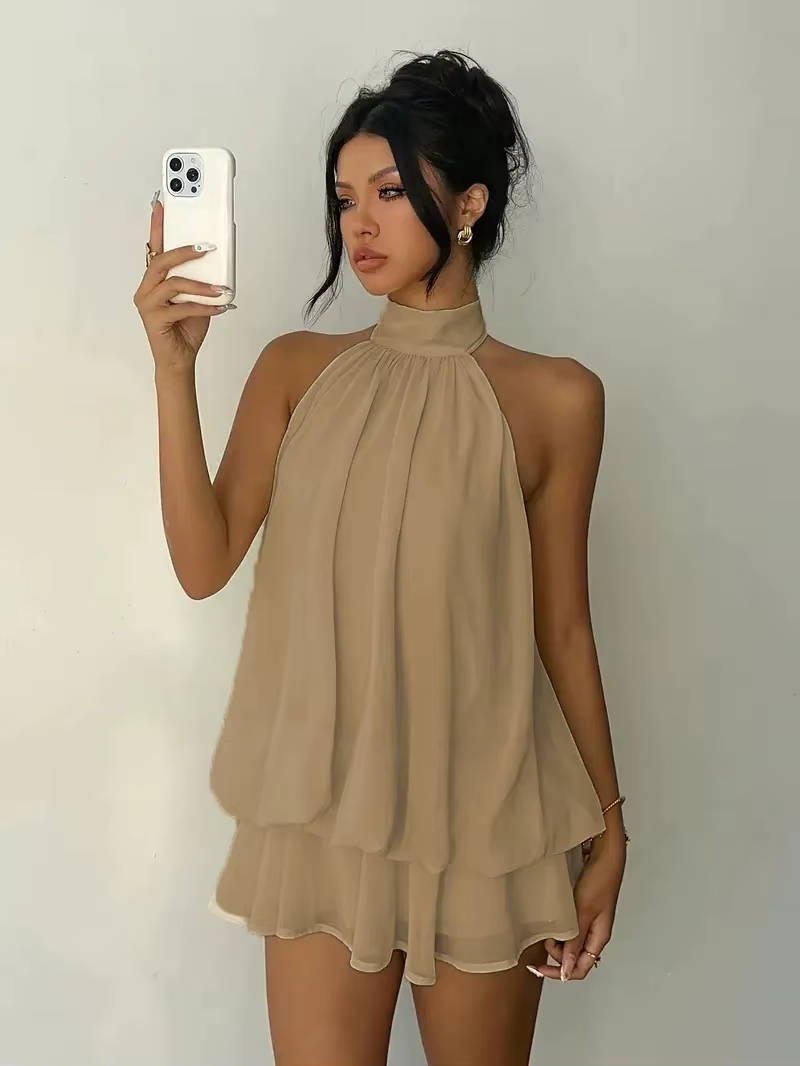Women's short halter dress, perfect for summer, featuring a lovely ruffle hem and a striking open back.