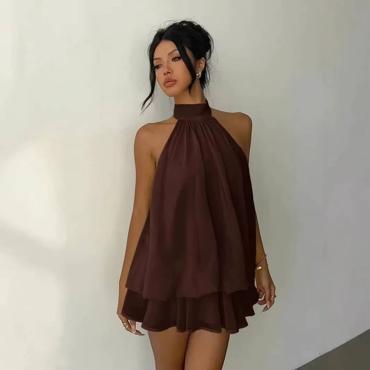 Women's versatile halter mini dress, ideal for summer events, with ruffle hem & captivating open back.
