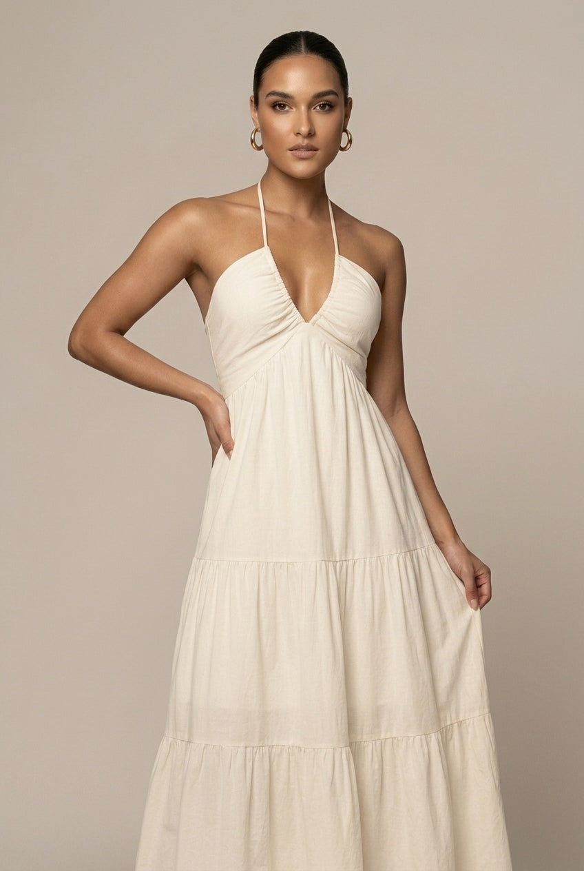Perfect summer formal wear: women's halter neck tiered maxi dress with ruffle skirt, open back tie waist.