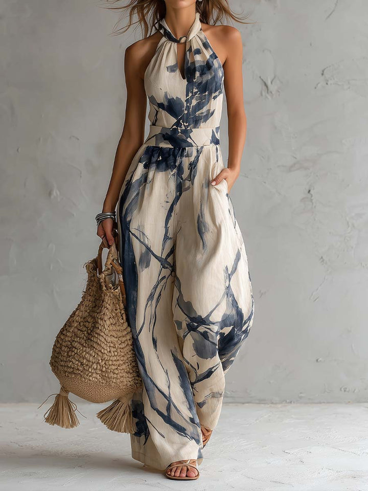 Women's elegant halter neck wide leg jumpsuit with practical pockets, perfect for summer casual or spring events.