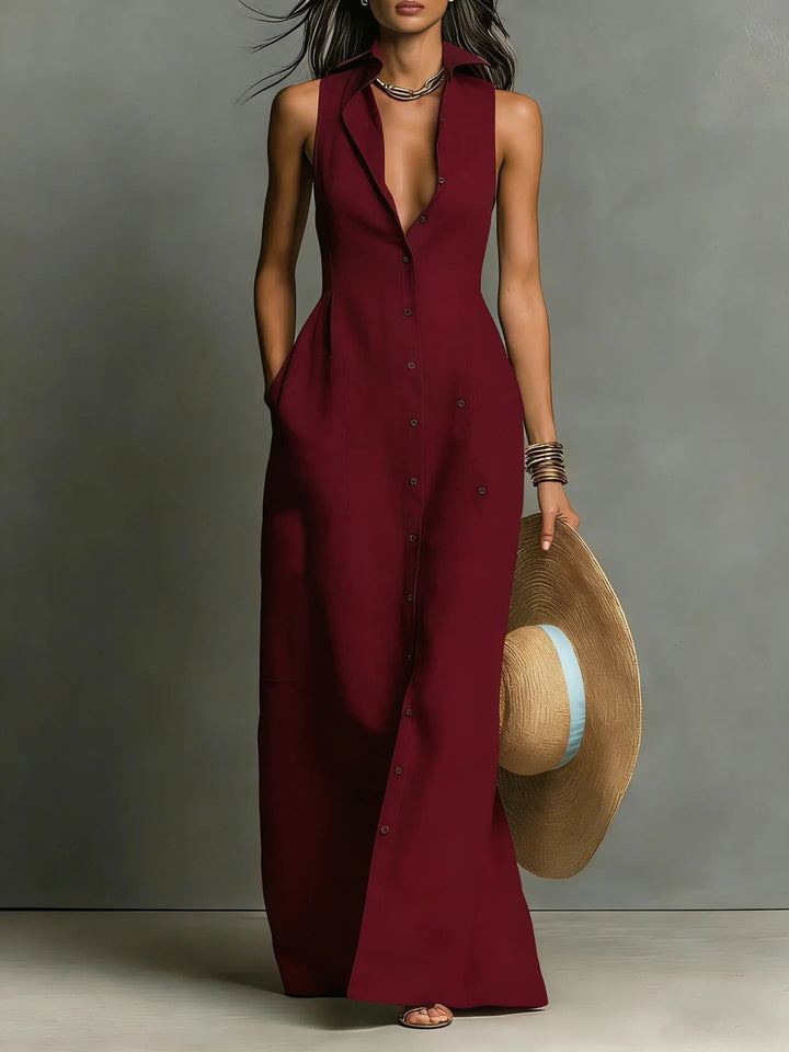 Close-up of lapel and button-front detail on an elegant women's sleeveless maxi shirt dress for spring/summer.