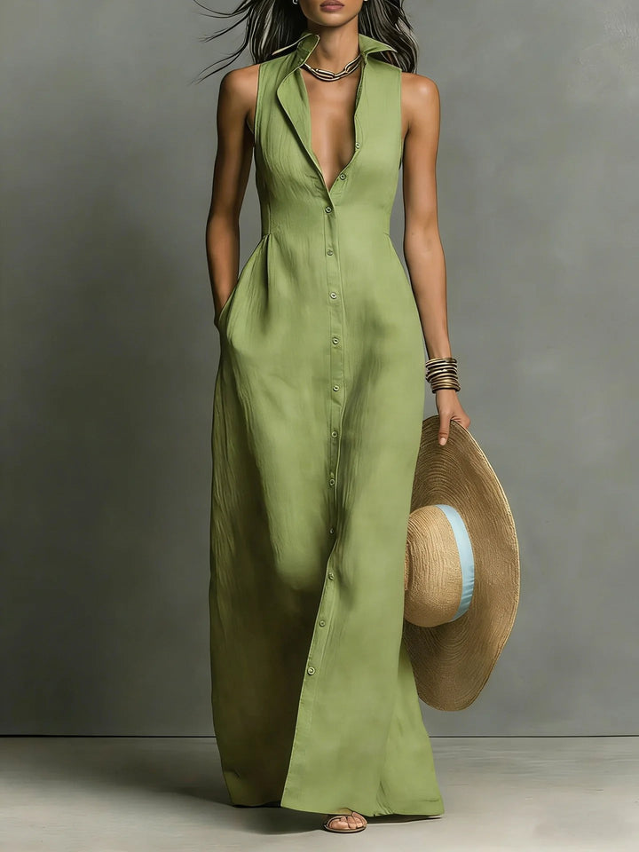 Side view of a flattering silhouette of a women's elegant lapel sleeveless button-front maxi shirt dress.