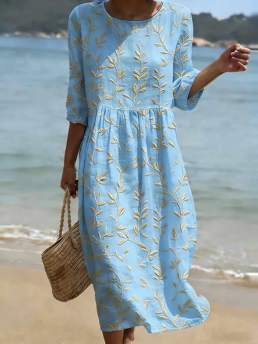 Women's elegant leaf vine embroidered 3/4 sleeve smock midi dress, perfect for summer vacation. Relaxed botanical style.