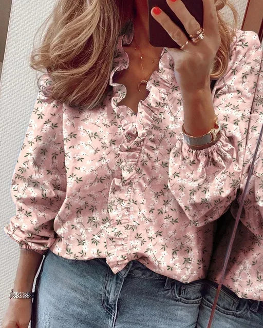 Fashionable women's long sleeve V-neck blouse with elegant ruffles, ideal for office wear.