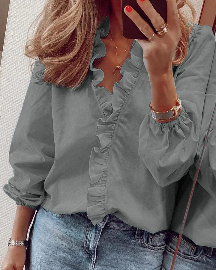 Chic women's long sleeve V-neck blouse with ruffles, a versatile fashion top for any season.