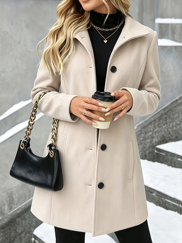 Elegant women's longline coat featuring a distinct notch collar, perfect for sophisticated winter style.