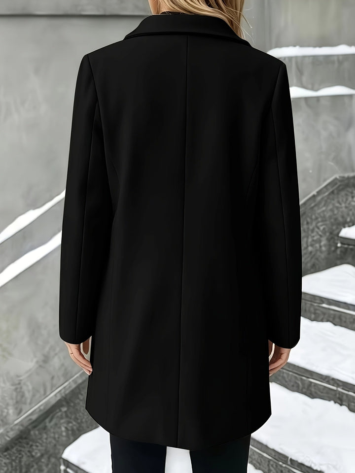 Tailored longline women's winter coat, single-breasted design with a chic notch collar. Elegant.