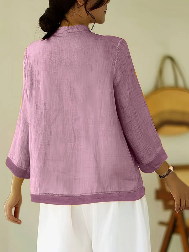 Stylish women's work blouse, mandarin collar, frog buttons, three-quarter sleeves. Professional & chic.