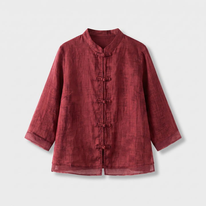 Versatile women's blouse: mandarin collar, frog buttons, three-quarter sleeves. Blends casual & elegant.