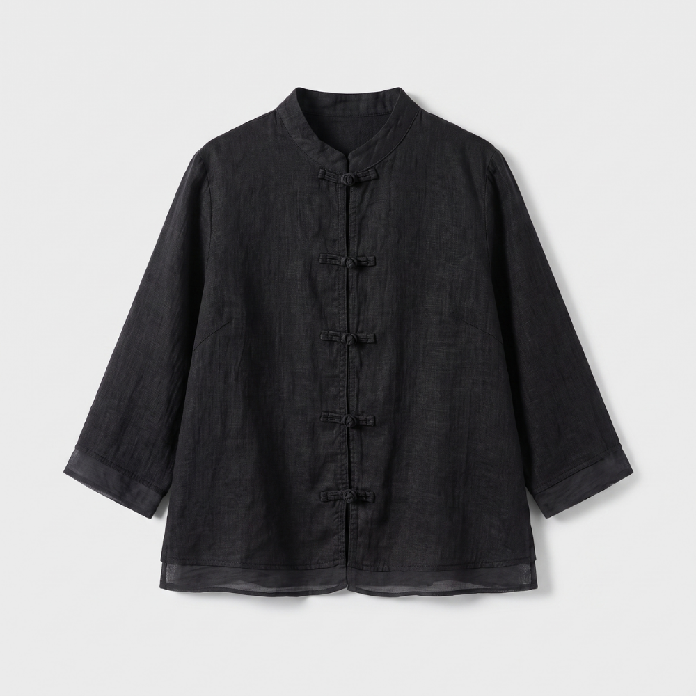 Women's tailored fit blouse with elegant mandarin collar and frog button detailing. Three-quarter sleeve.