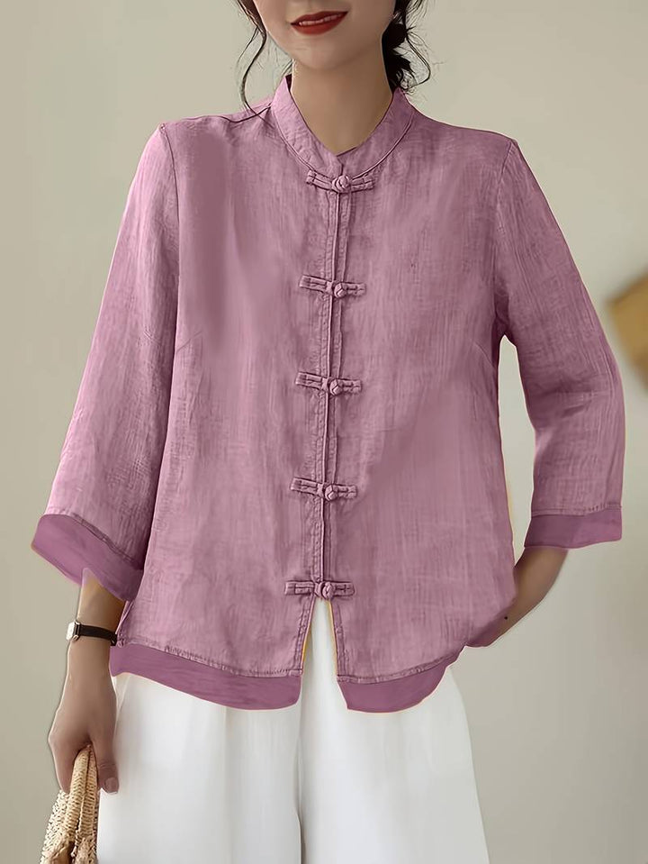 Casual yet elegant women's blouse, featuring a mandarin collar & frog buttons. Perfect for summer style.