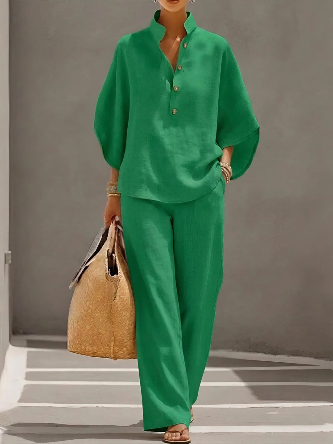 Breathable women's two-piece set, featuring a mandarin collar top and flowing wide-leg pants for summer.