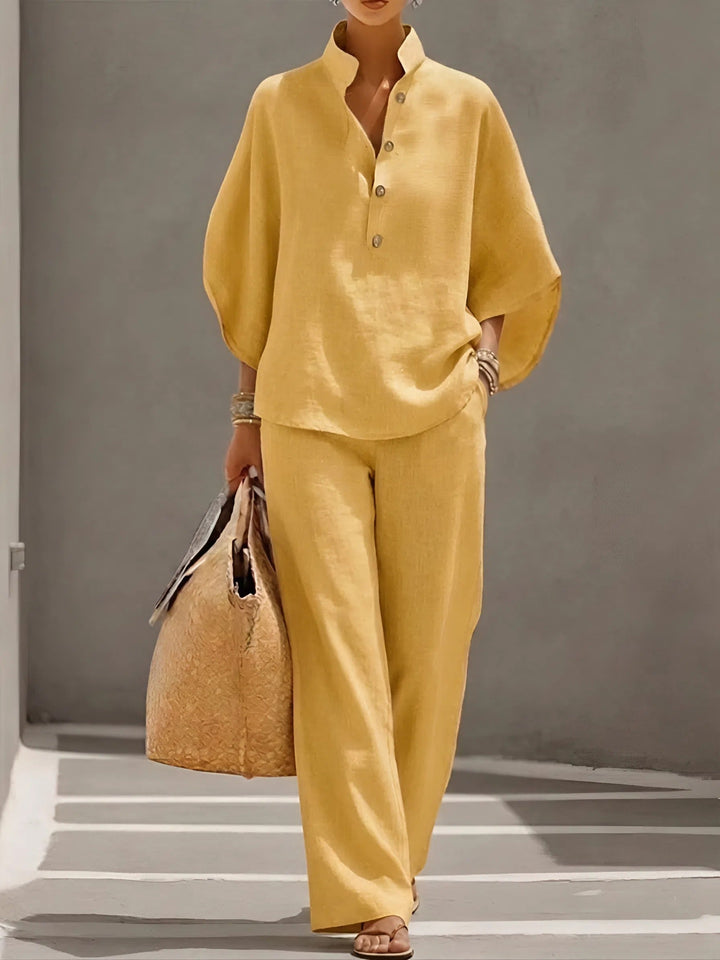 Full view of a woman wearing a casual yet elegant mandarin collar wide-leg two-piece summer set.