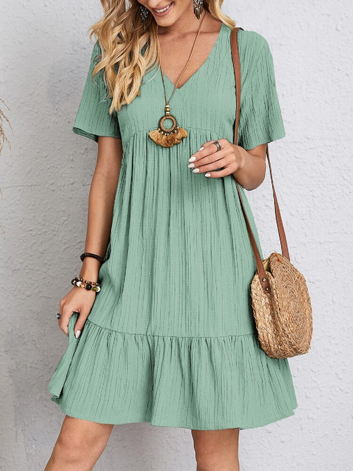 Elegant women's midi dress, perfect for evening events, offering a flattering fit and chic modest style.