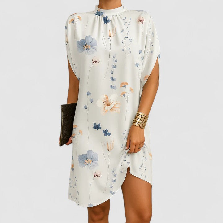 Stylish women's blue mock neck midi dress with flowy batwing split sleeves. Modern spring fashion.