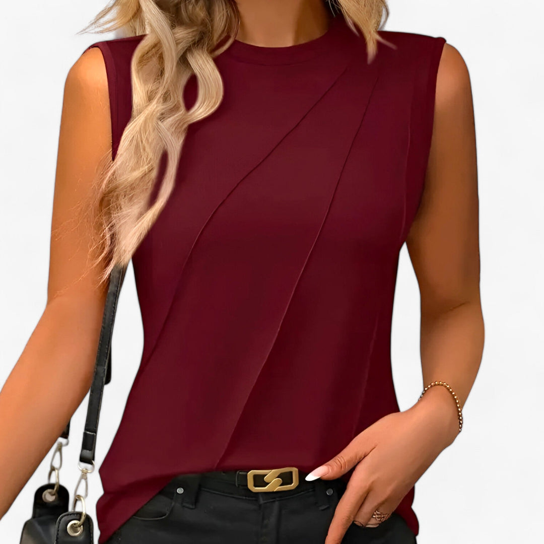 Women's elegant sleeveless mock neck blouse. Relaxed fit, perfect for summer office wear or versatile evening outfit.