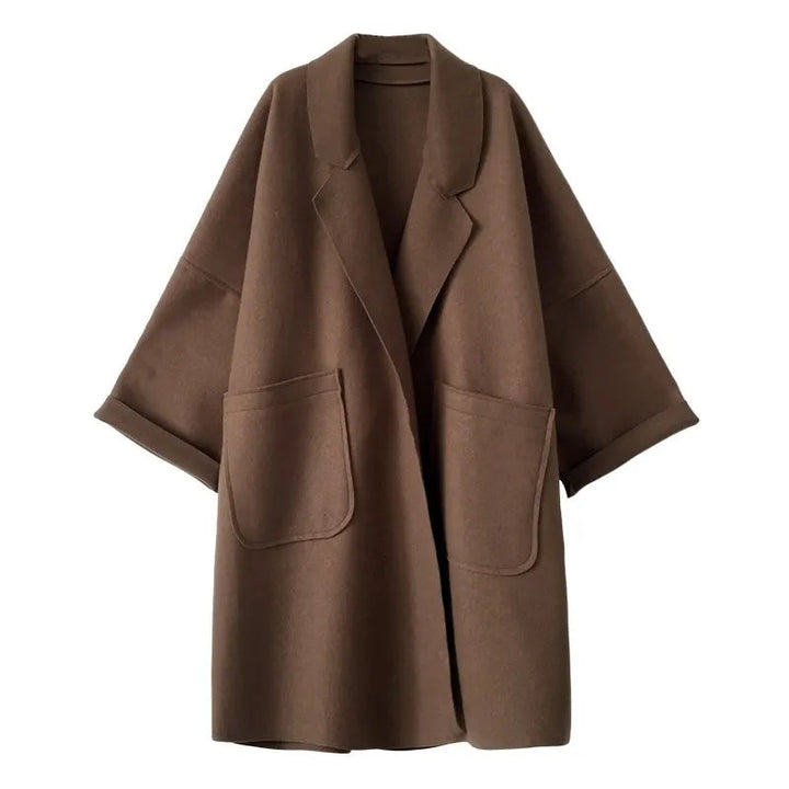 Women's elegant oversized trench coat in a classic style, perfect for fall fashion and business casual outfits.
