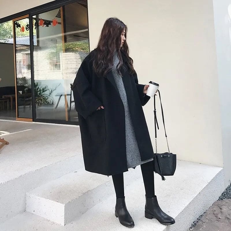 Stylish women's oversized trench coat with a classic collar and belt, offering a chic look for fall outerwear.