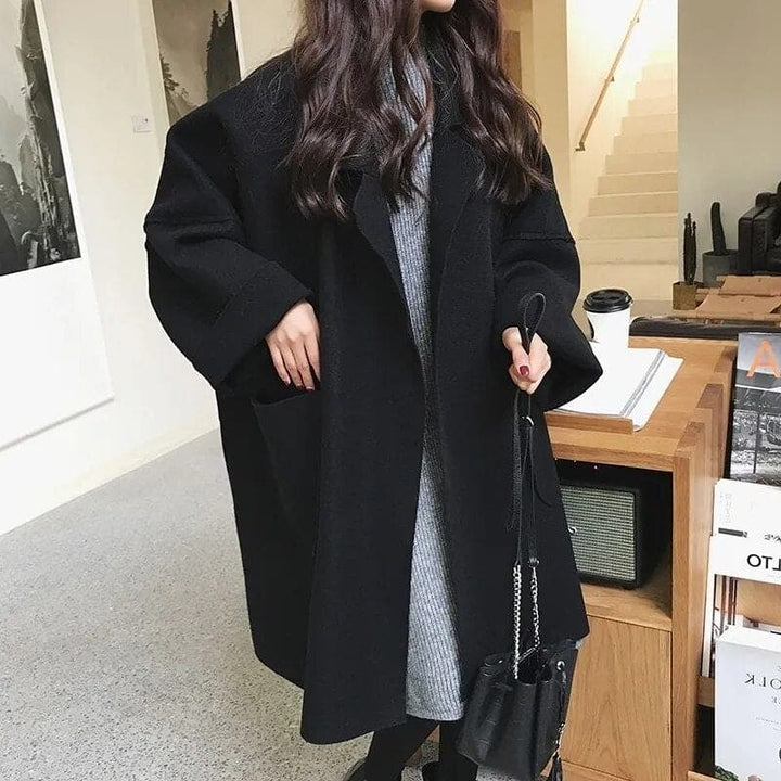 Fashionable women's oversized trench coat, an elegant and chic outerwear choice for fall and winter seasons.