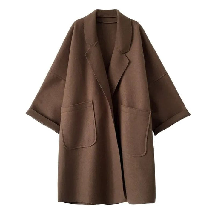 Professional women's oversized trench coat, a sophisticated outerwear piece for elegant business casual outfits.