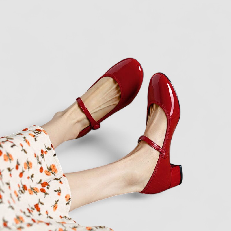 Glossy patent Mary Jane shoes for women, featuring a secure strap, round toe, and stable block heel. Elegant & comfortable.