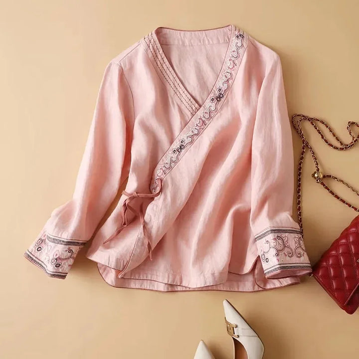 Women's elegant patterned blouse, relaxed fit, V-neck. Stylish & comfortable for casual wear.