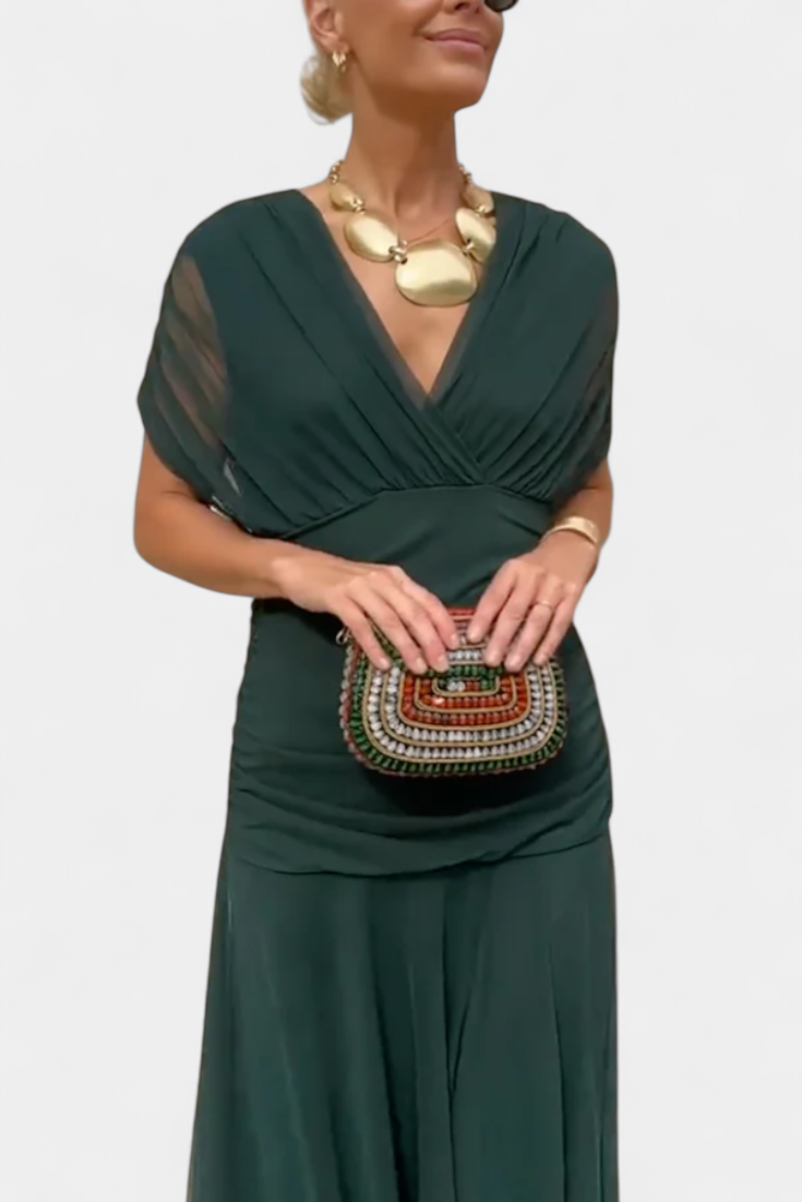 Women's elegant long dress with a pleated waist, ideal for formal parties & events.