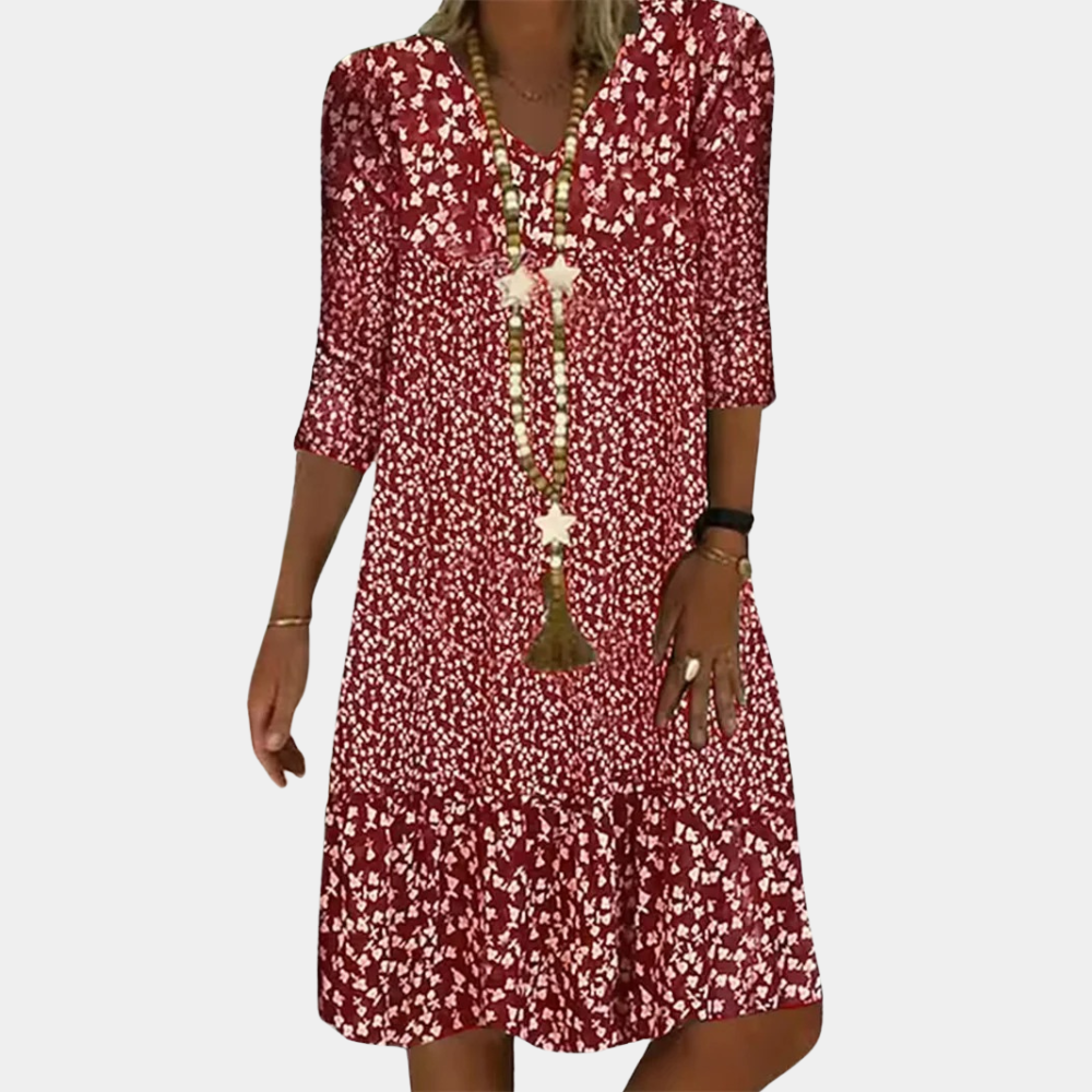 Flowy women's printed midi dress with a comfortable A-line fit. Features a stylish V-neck and 3/4 sleeves, ideal for summer.