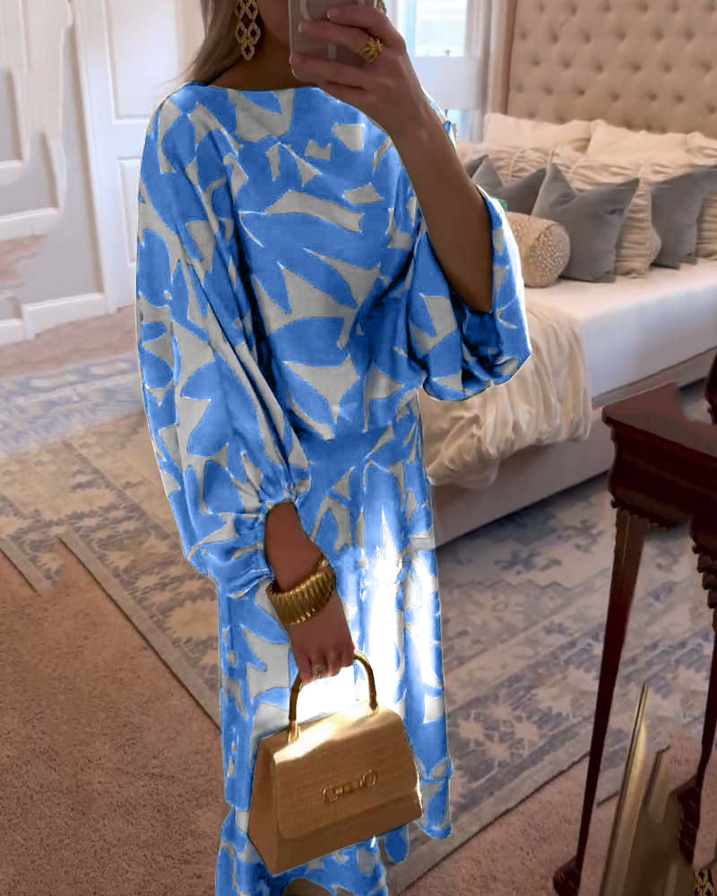 Modern women's two-piece set featuring a vibrant print and trendy lantern sleeves.