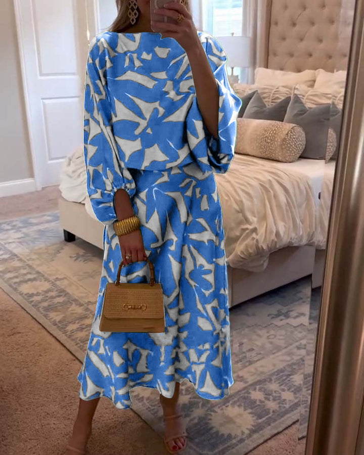 Versatile women's matching set: vibrant print top & skirt with elegant lantern sleeves.