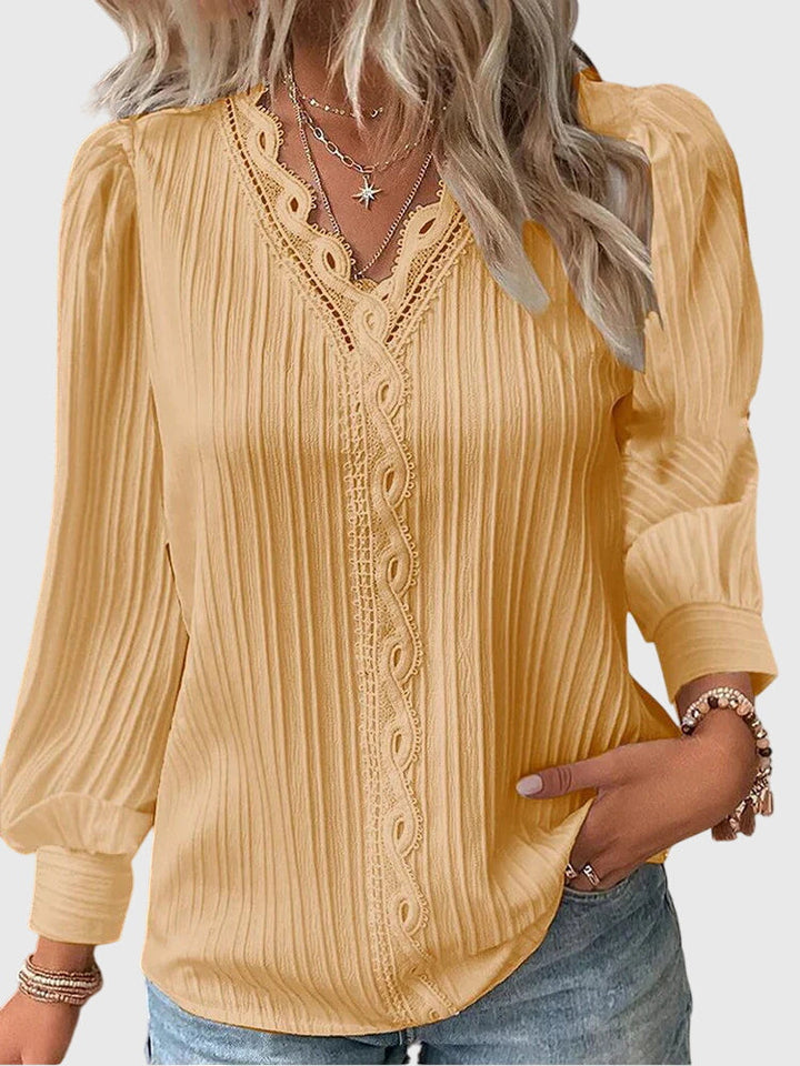 Women's elegant pullover blouse, chic long sleeve top for versatile fashion.
