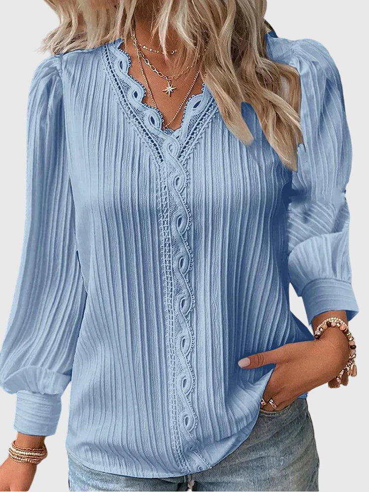 Versatile women's pullover blouse, elegant long sleeve top for work, casual, or dressy occasions.