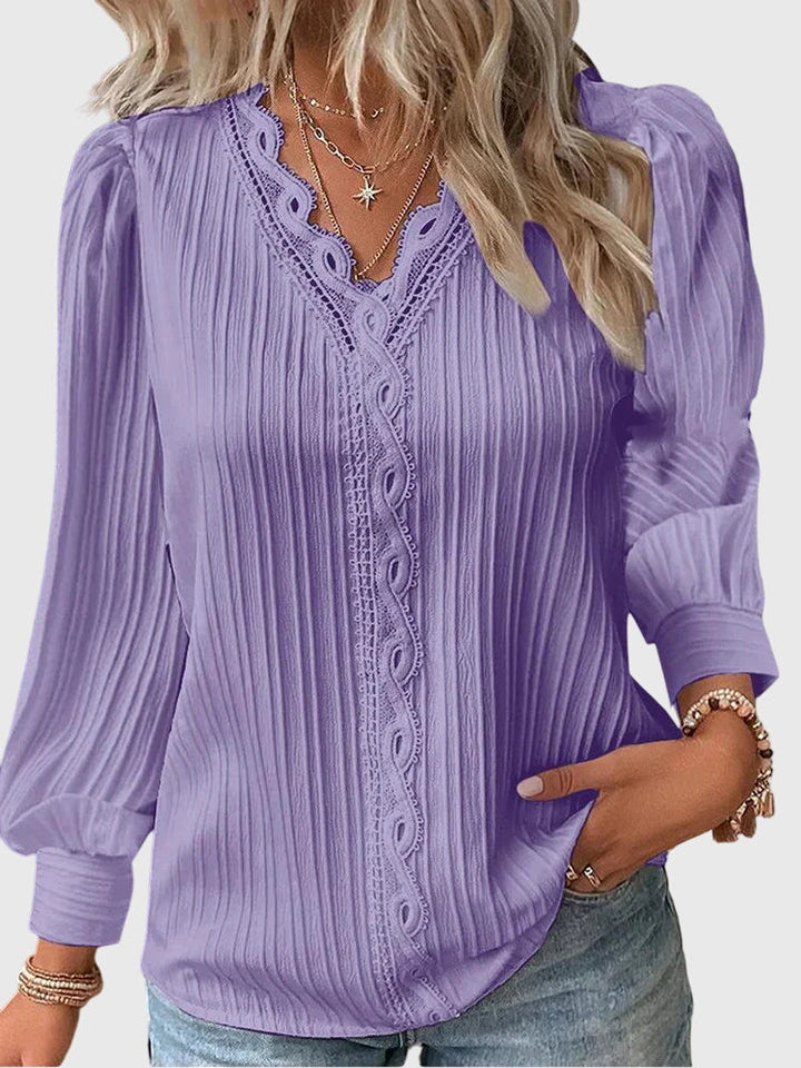 Stylish women's pullover blouse, a chic long sleeve top that transitions from day to night.