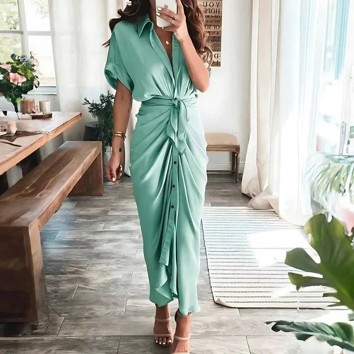Sophisticated women's ruched midi dress. Short sleeve, tie waist, button front, collared for elegant look.