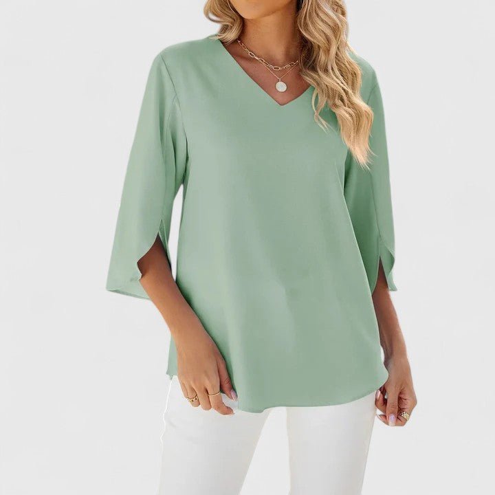 Casual chic women's ruffle V-neck blouse with elegant split sleeves, great for spring/summer.