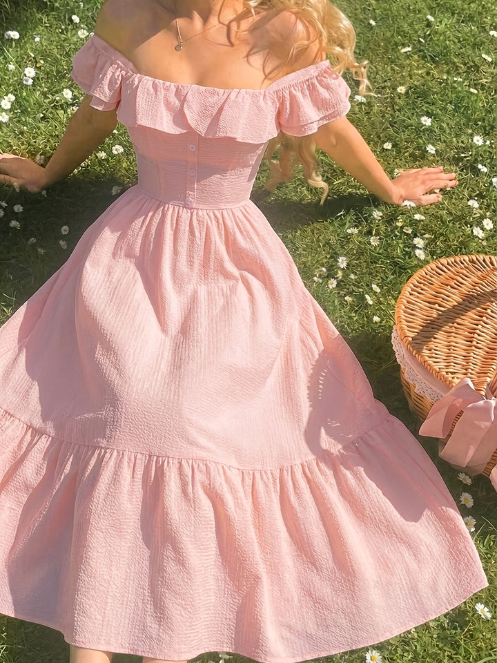 Women's party-ready ruffled off-shoulder maxi dress, offering a sophisticated and flowy silhouette.