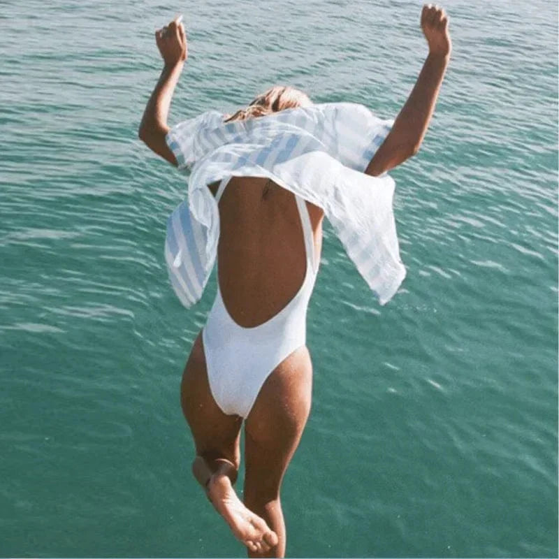 Classic women's scoop neck one-piece swimsuit featuring a sophisticated open back, ideal for summer.