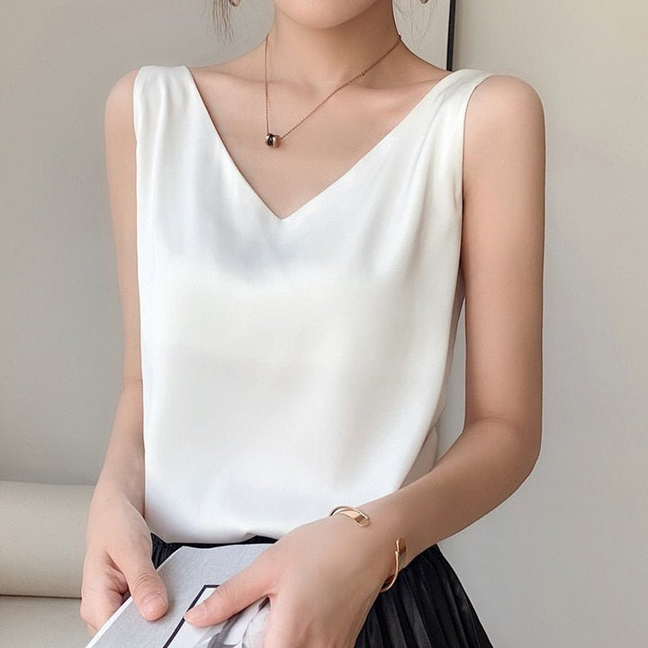 Polished women's silky tank top, draped and sleeveless. Effortlessly chic for both casual and dressy occasions.