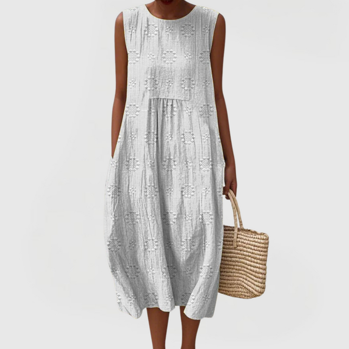 Comfortable & flowy women's elegant sleeveless dress with functional pockets; ideal for warm weather style.