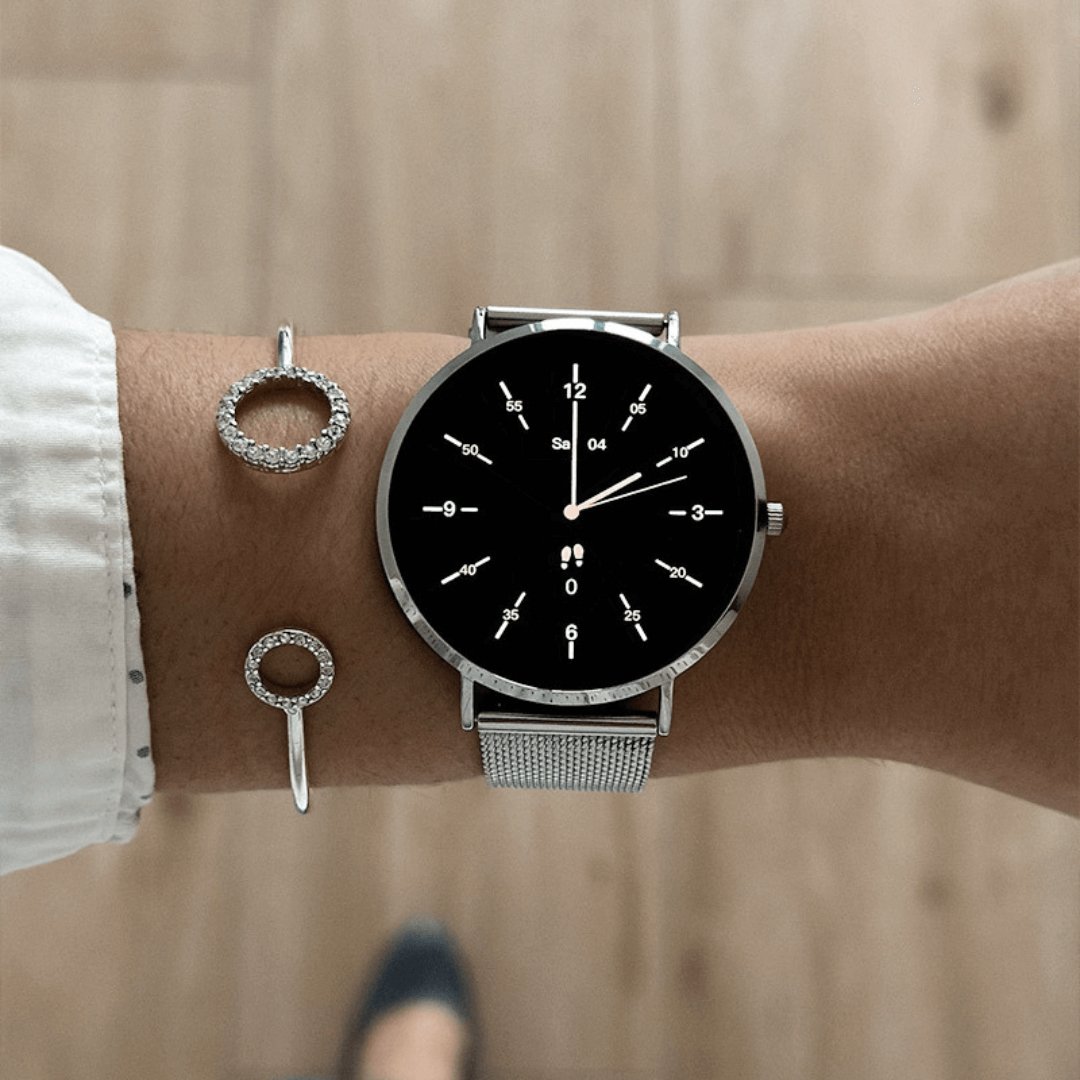 Close-up of elegant women's smartwatch display, showing health metrics. Rose gold casing.