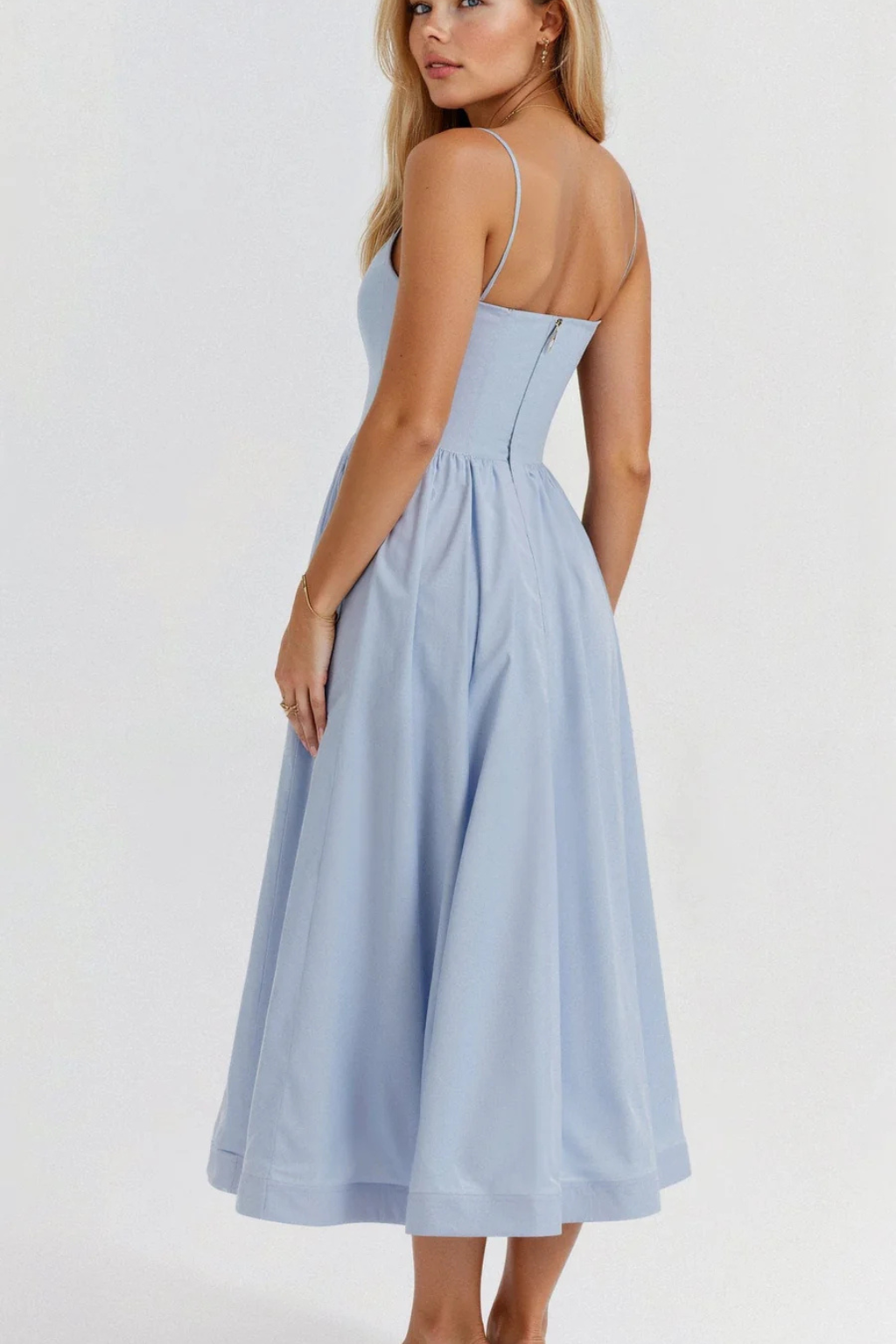 Stylish sleeveless women's midi dress. Spaghetti strap design, perfect for warm weather elegance.