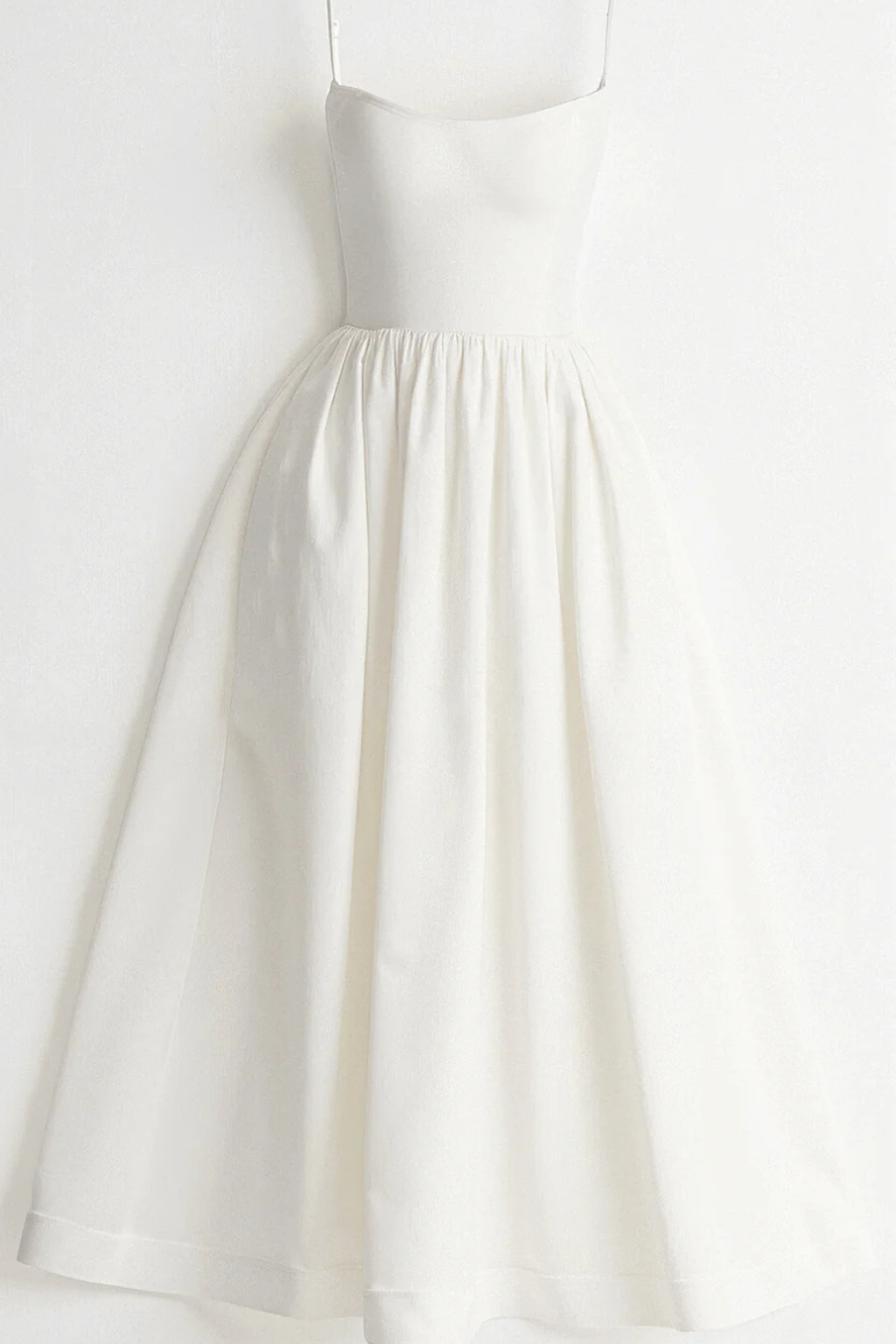 Chic women's spaghetti strap midi dress. Flared and elegant for a versatile warm-weather look.