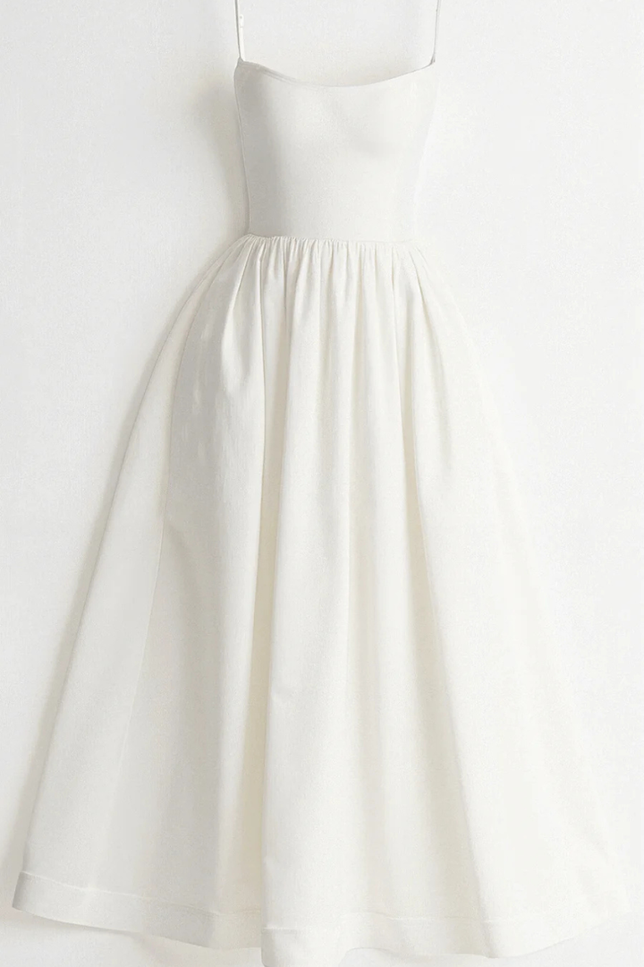 Chic women's spaghetti strap midi dress. Flared and elegant for a versatile warm-weather look.