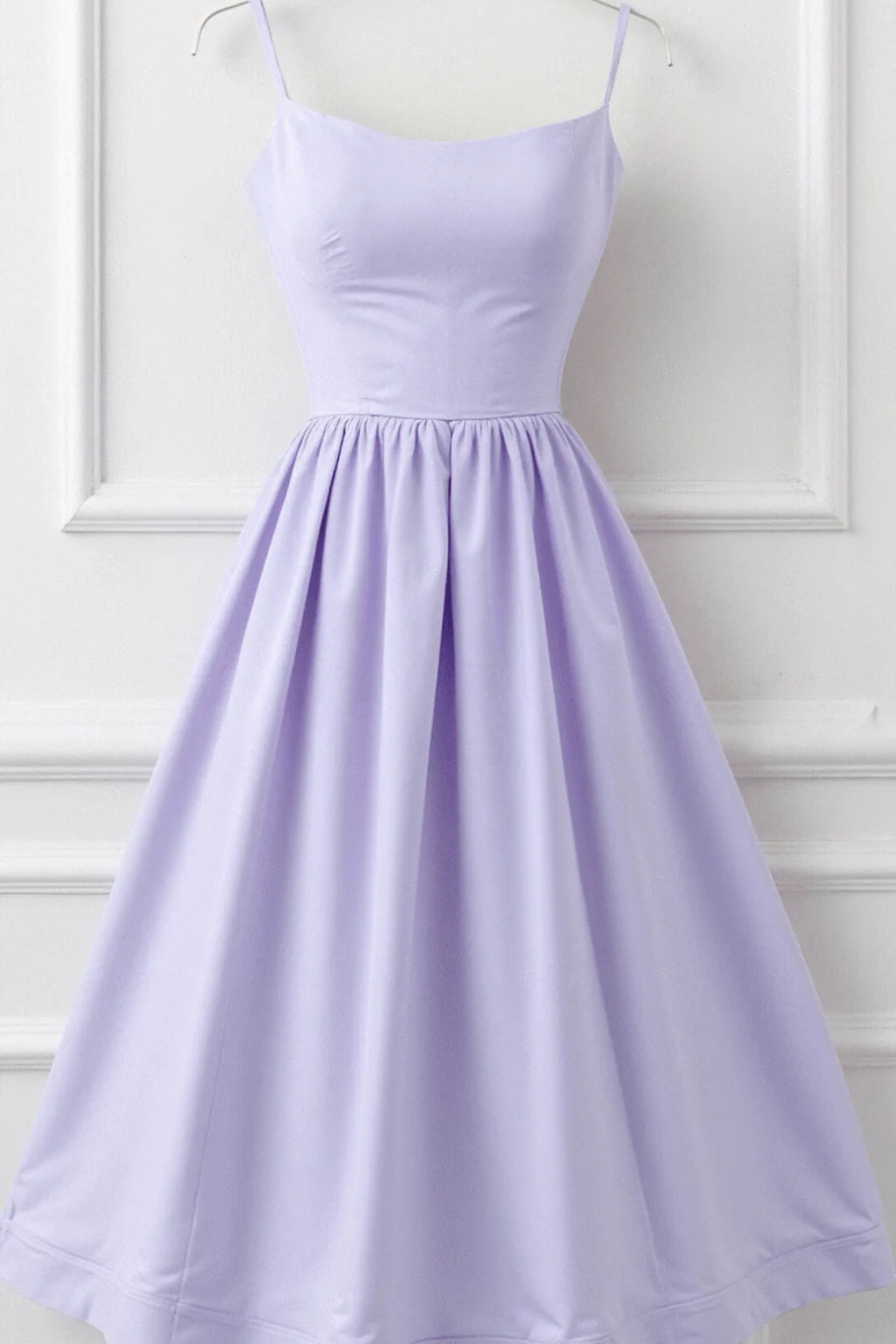 Flared midi sundress for women. Sleeveless spaghetti strap design, ideal for summer.
