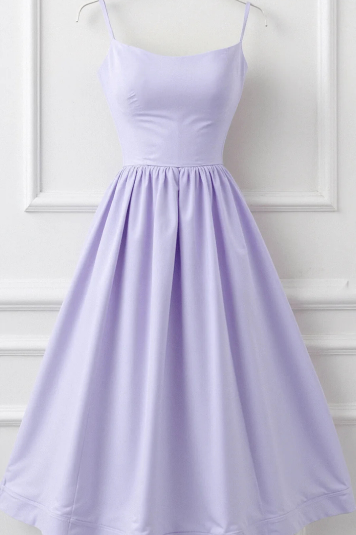 Flared midi sundress for women. Sleeveless spaghetti strap design, ideal for summer.