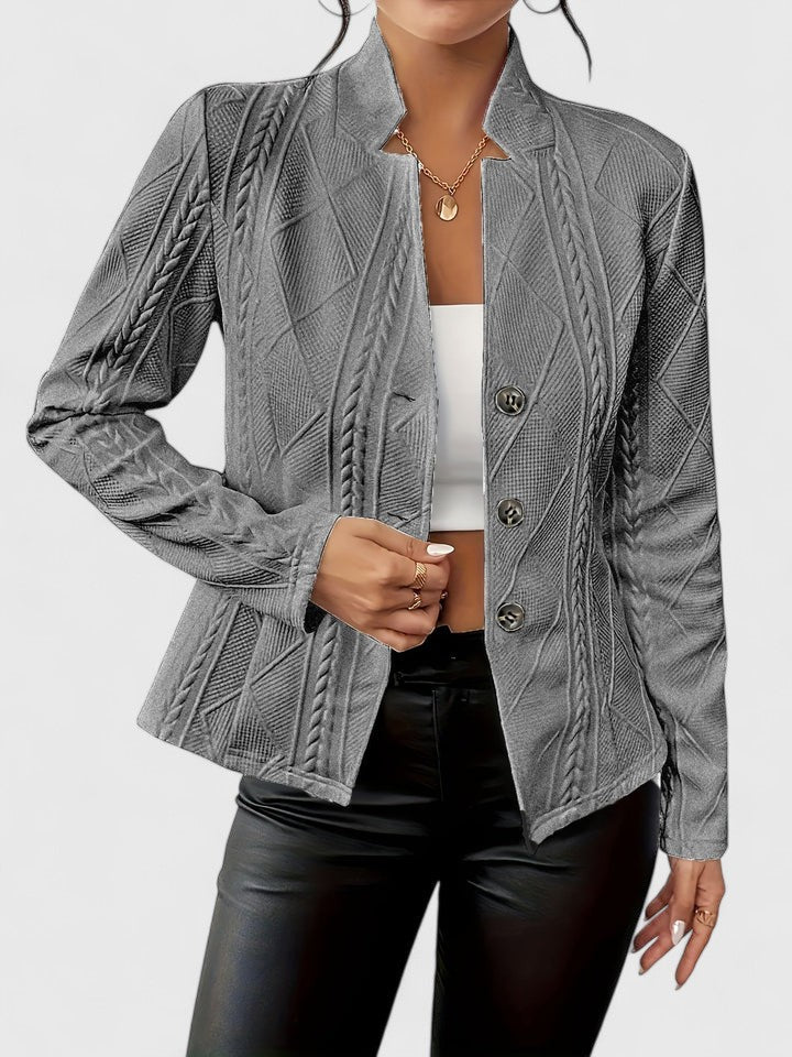 Tailored women's structured jacket in a modern texture. Ideal for formal attire & chic outerwear.