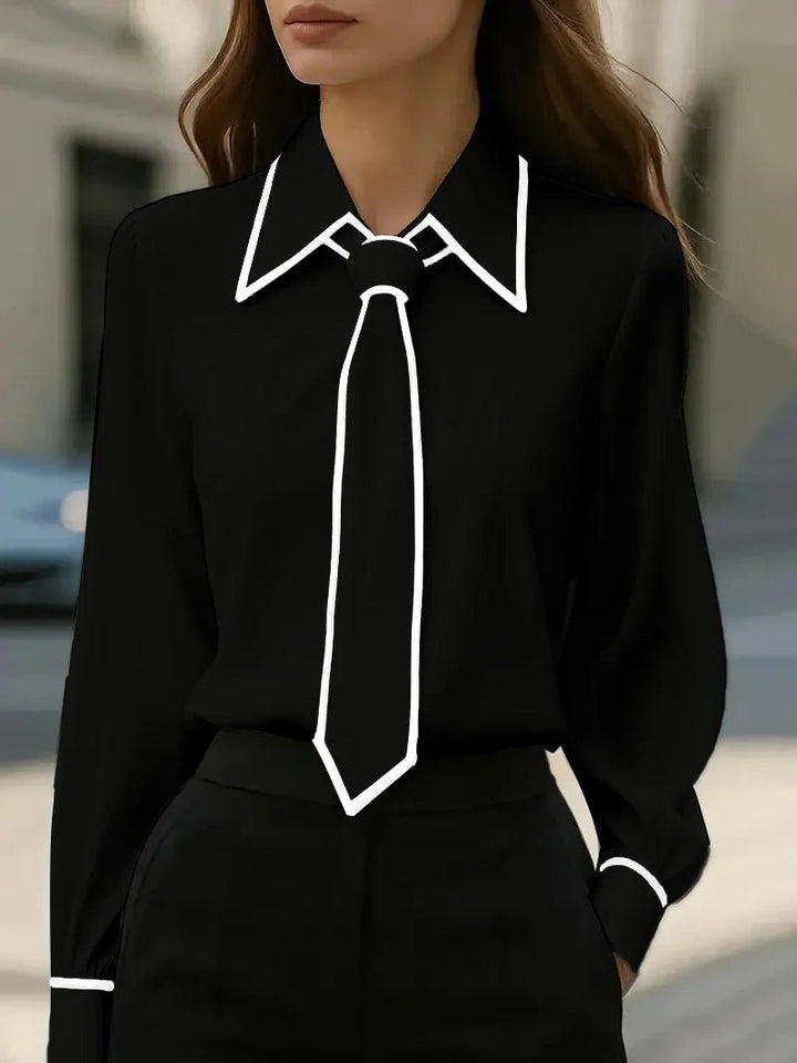 Long sleeve women's blouse with an elegant tie neck and unique contrast trim, ideal for smart casual or office.