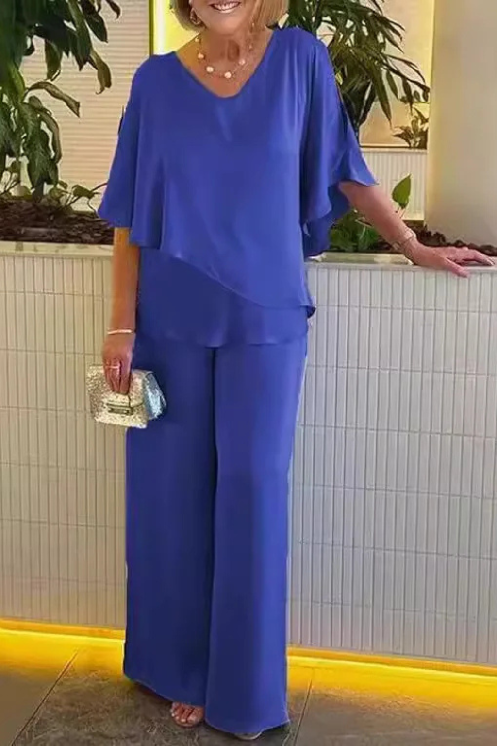 Sophisticated women's batwing sleeve V-neck top and wide leg pant set. Versatile two-piece for stylish women.